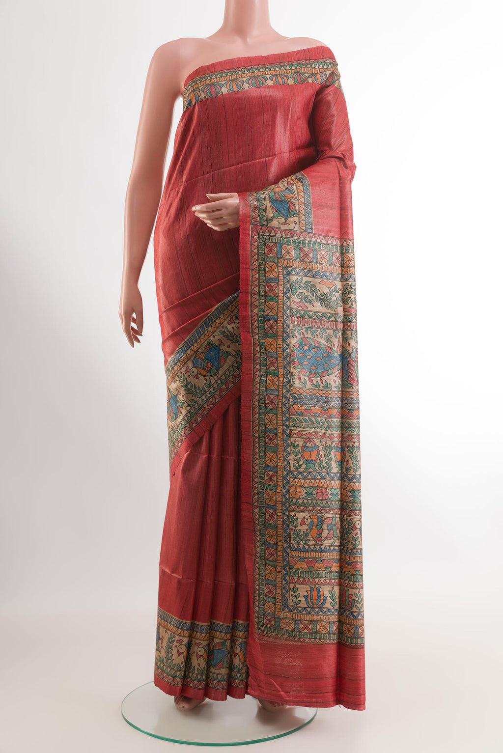 Red Tussar Saree with Plain Body and Printed Border.  displayed on a mannequin