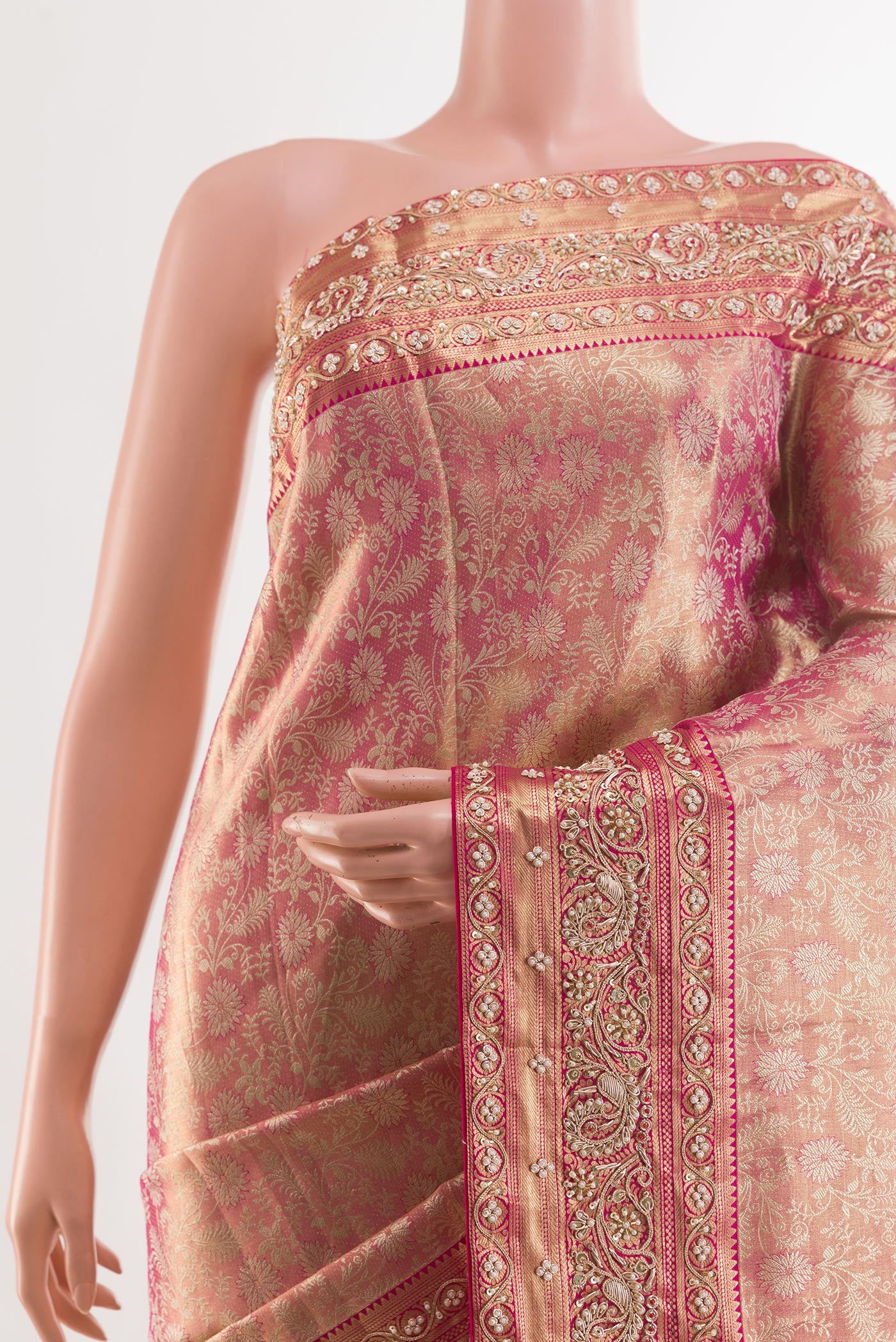 Border image of Rose pink Kanjivaram Tissue Silk Saree with Embroidery on the body and Zari Border. 