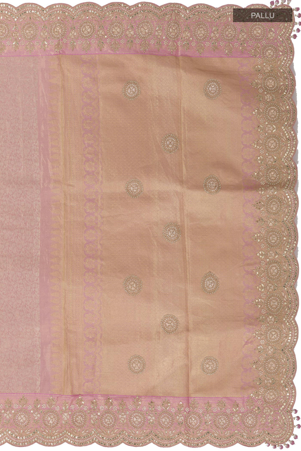 Close up image of the pallu of Rose Gold Kanjivaram Tissue Silk Saree with Zari Brocade on the body and Embroidery Border. 