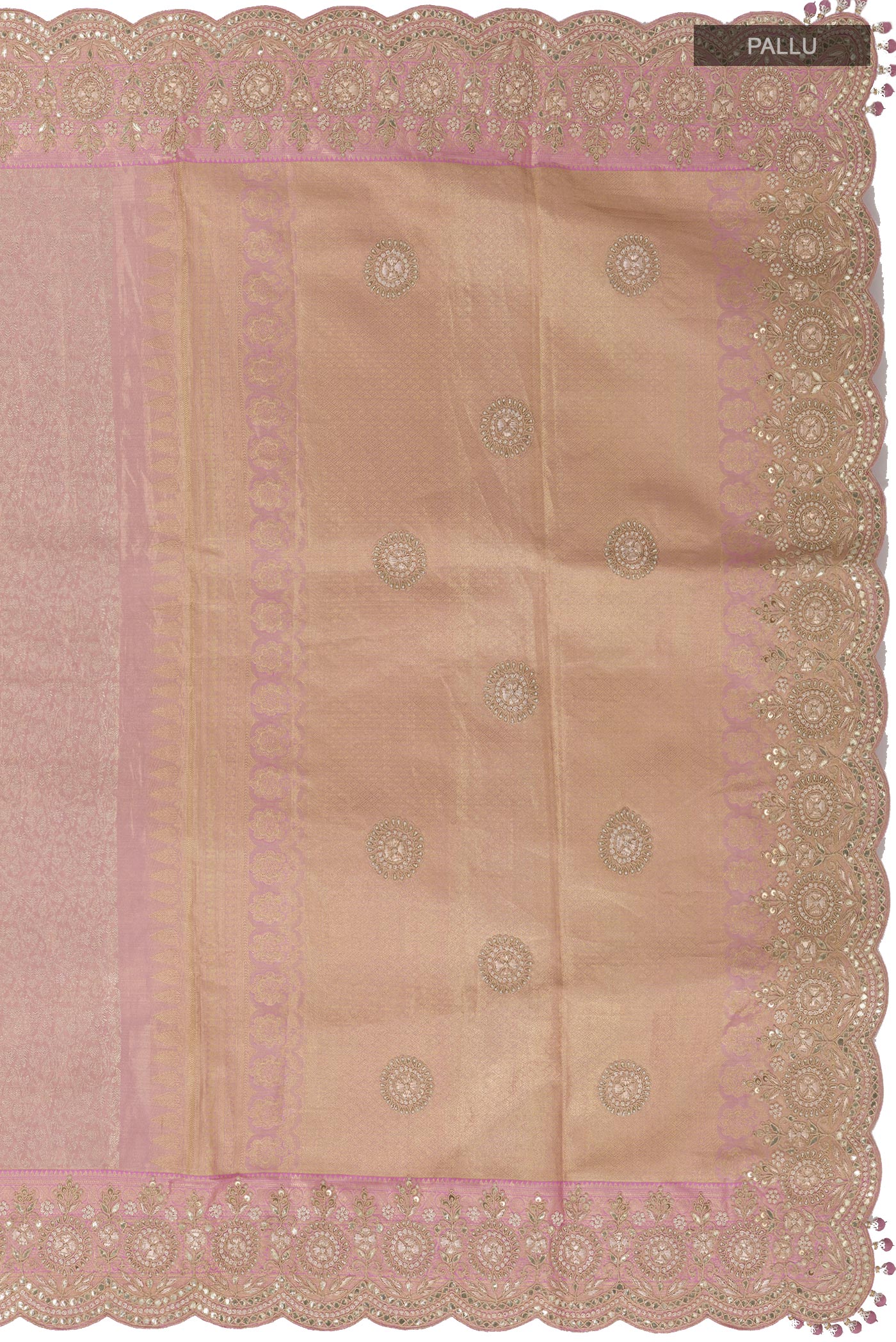 Close up image of the pallu of Rose Gold Kanjivaram Tissue Silk Saree with Zari Brocade on the body and Embroidery Border. 