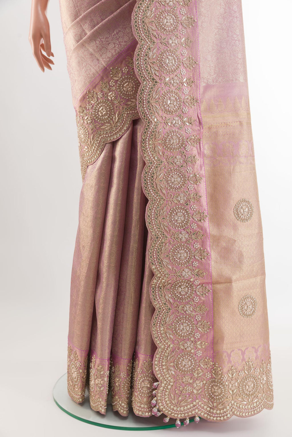 Pleats and pallu of Rose Gold Kanjivaram Tissue Silk Saree with Zari Brocade on the body and Embroidery Border. 