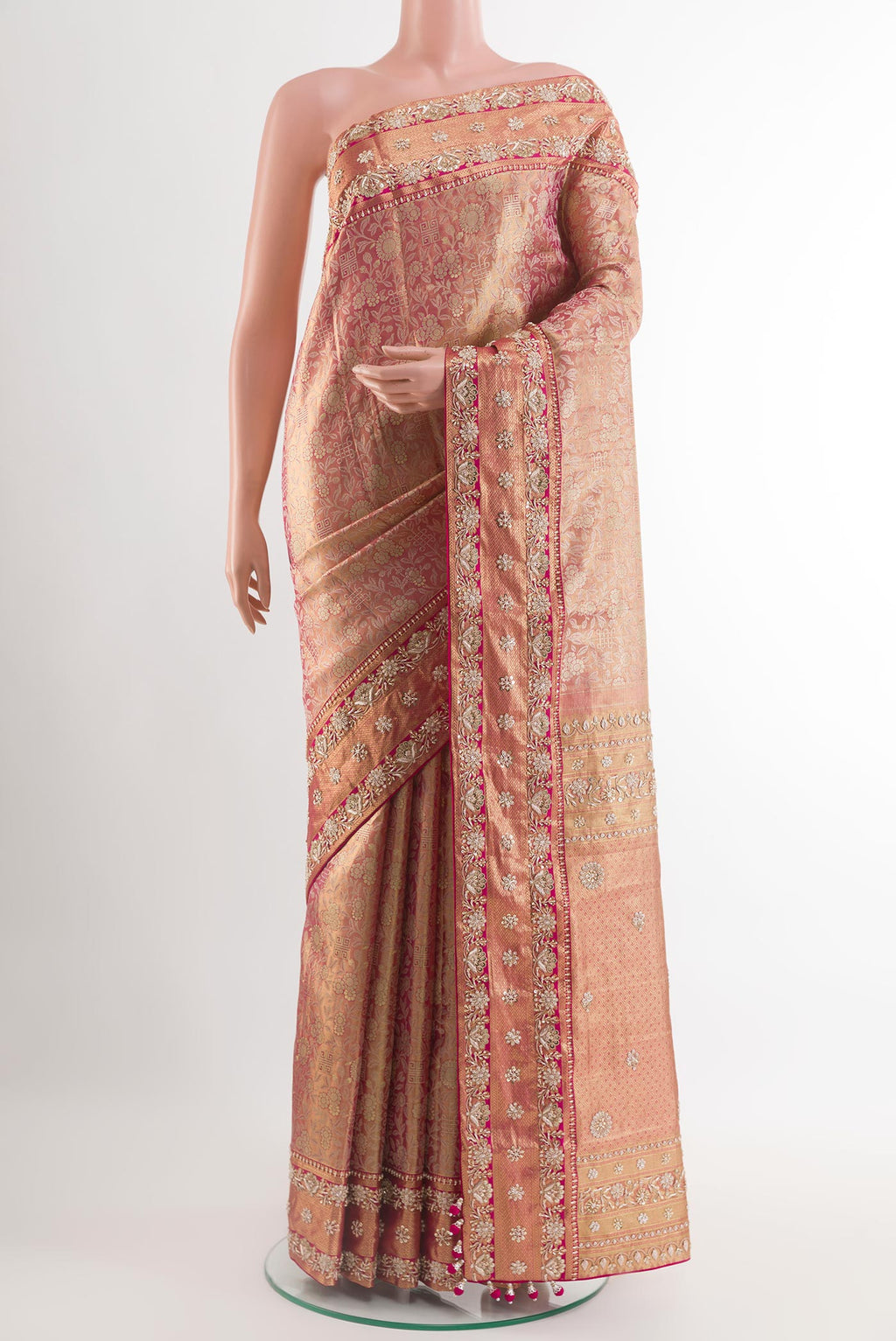 Pink Kanjivaram Tissue Silk Saree with Zari Brocade on the body and Embroidery Border.  displayed on a mannequin