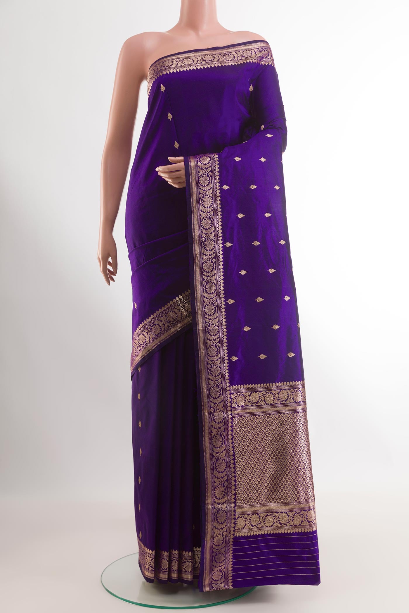 Purple Banarasi Katan Silk Saree with Zari Butta on the body and Zari Border.  displayed on a mannequin