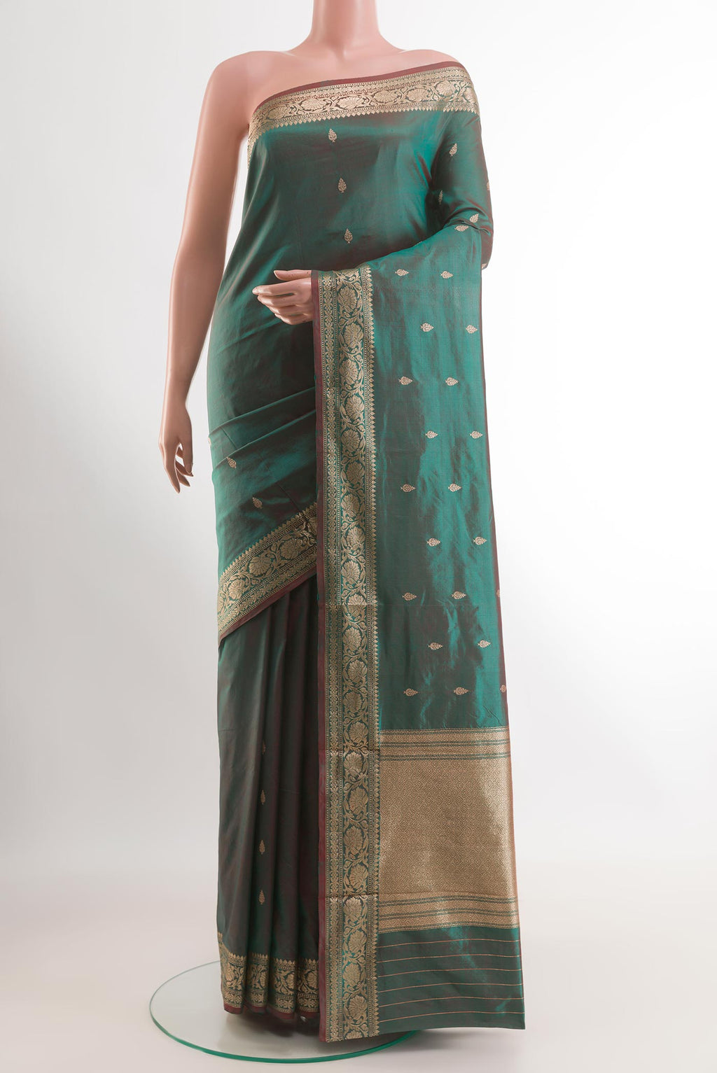 Green Banarasi Katan Silk Saree with Zari Butta on the body and Zari Border.  displayed on a mannequin