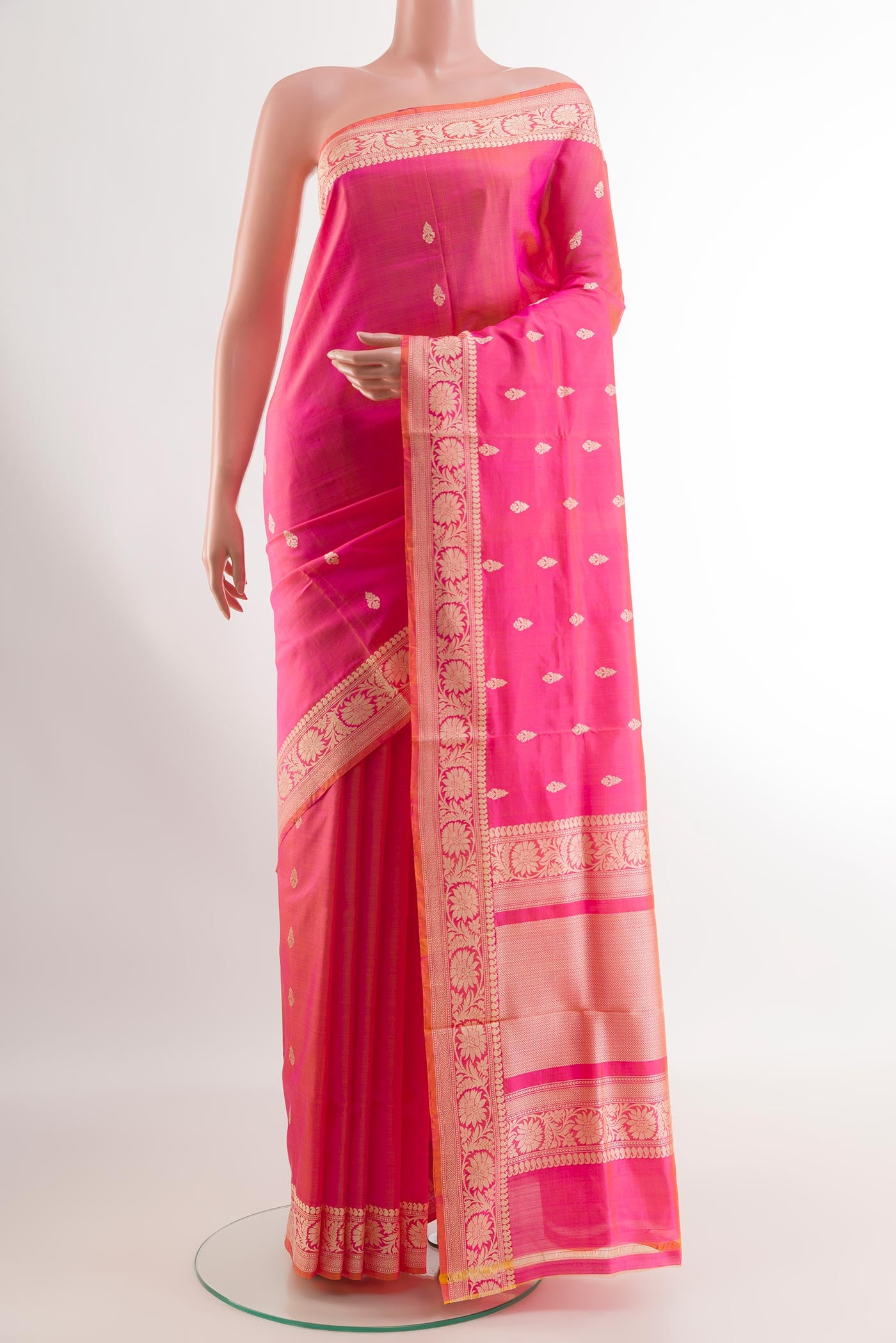 Pink Banarasi Katan Silk Saree with Zari Butta on the body and Zari Border.  displayed on a mannequin