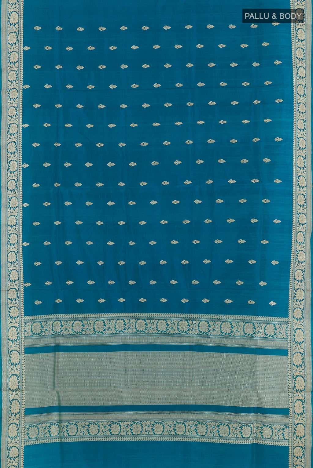 Flat view of Blue Banarasi Katan Silk Saree with Zari Butta on the body and Zari Border. 