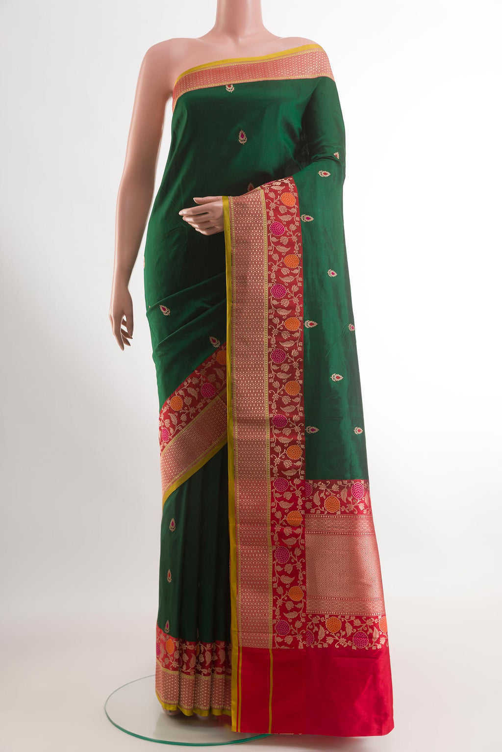 Green Banarasi Katan Silk Saree with Zari Butta on the body and Zari Border.  displayed on a mannequin