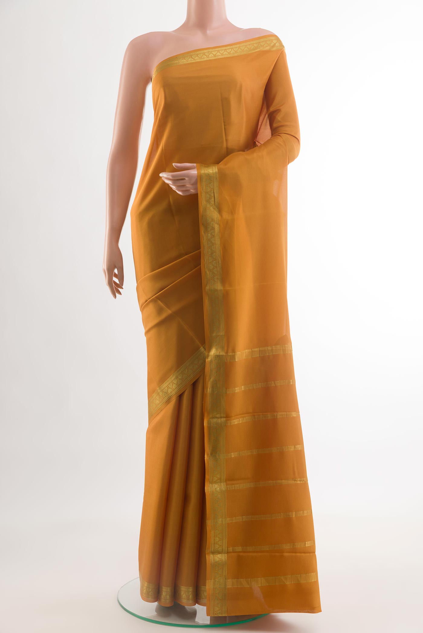 Mustard Mysore Crepe Saree with Plain Body and Zari Border.  displayed on a mannequin