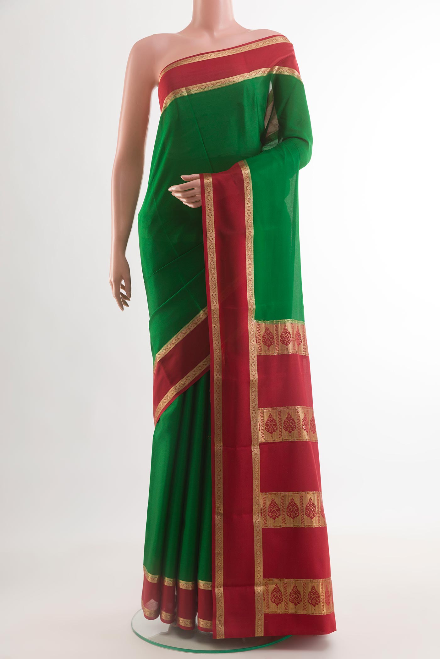Green Mysore Crepe Saree with Plain Body and Zari Border.  displayed on a mannequin