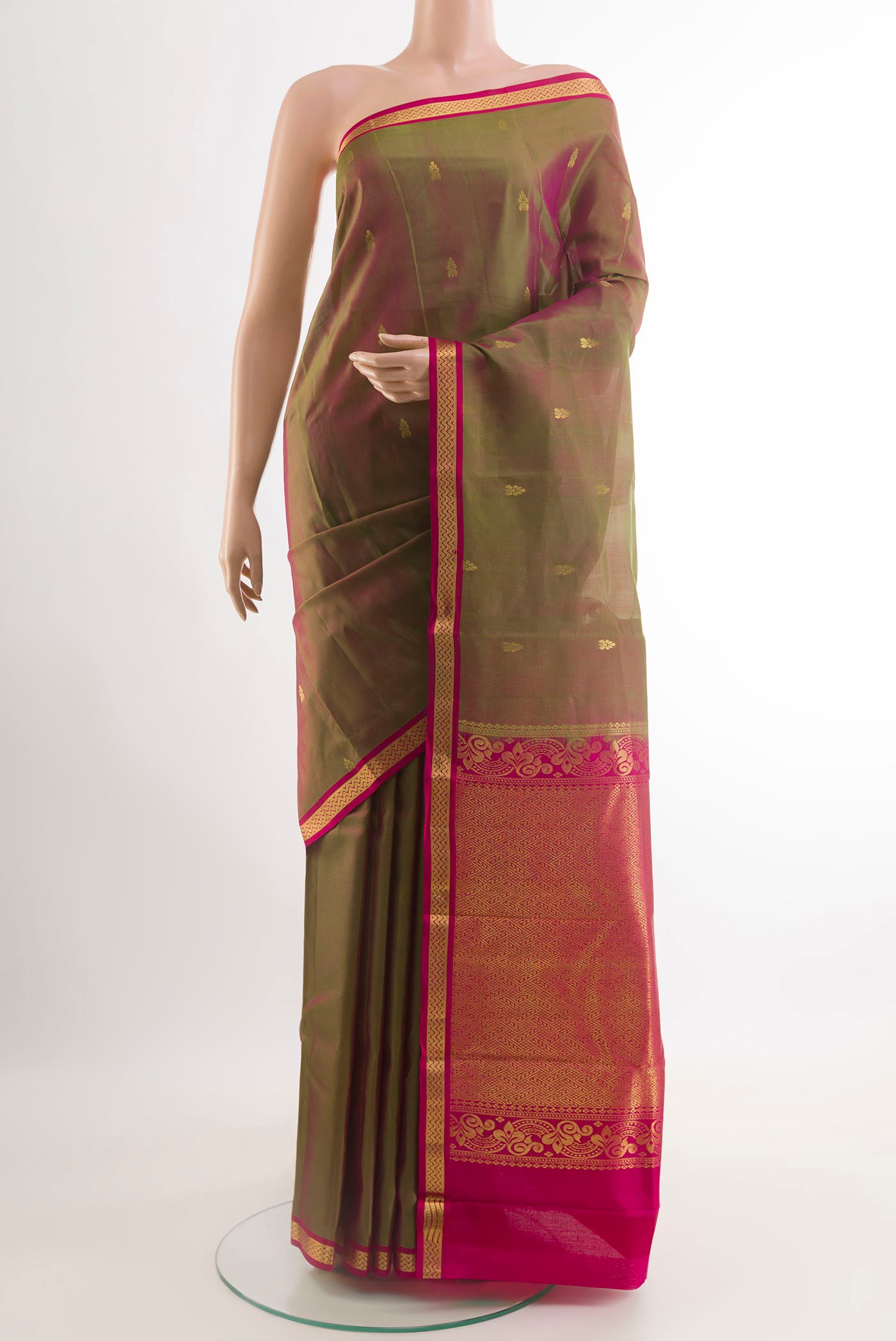 Mehandi Green Kanchipuram Silk Saree with Zari Butta on the body and Zari Border.  displayed on a mannequin