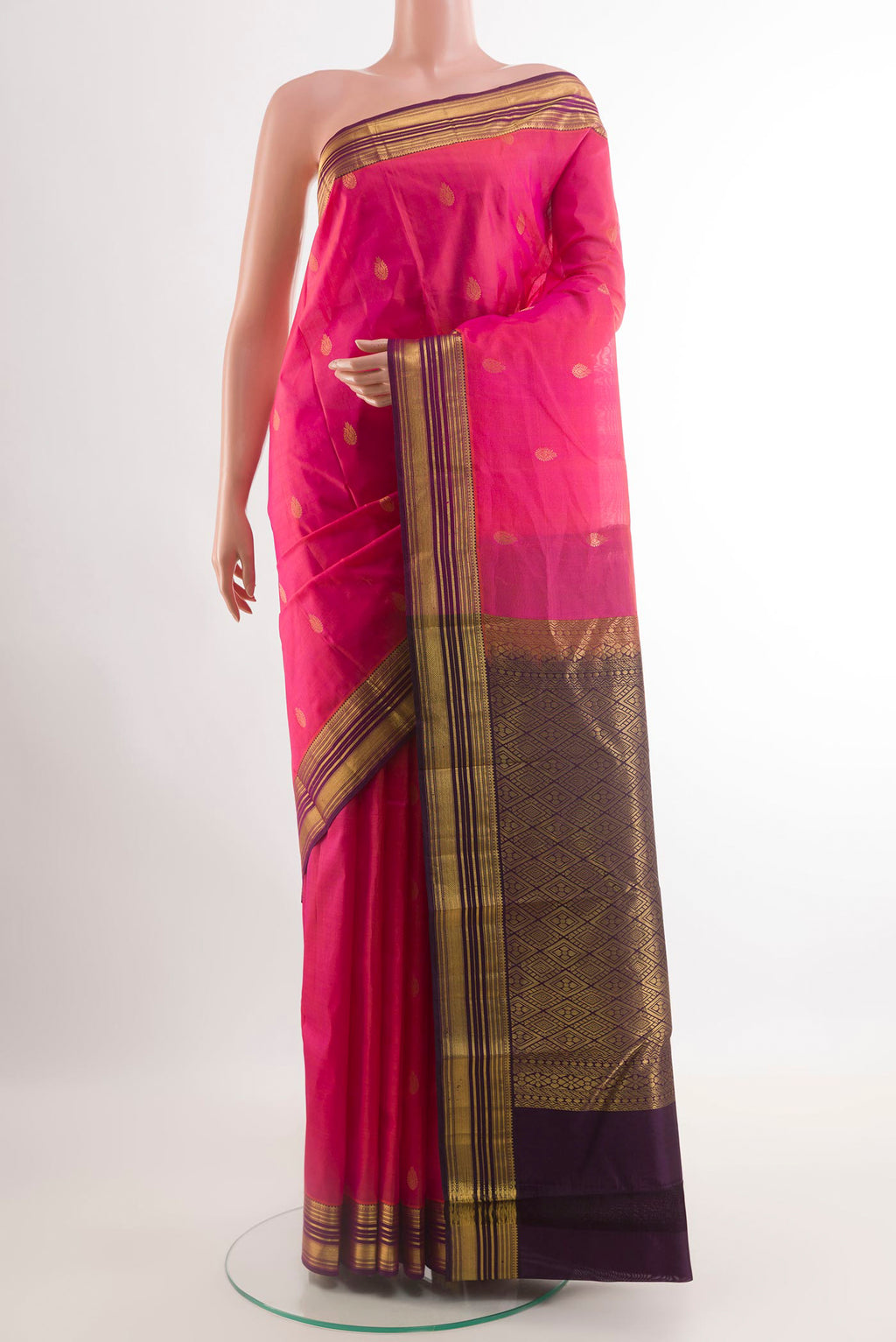 Pink Kanjivaram Silk Saree with Zari Butta on the body and Zari Border.  displayed on a mannequin