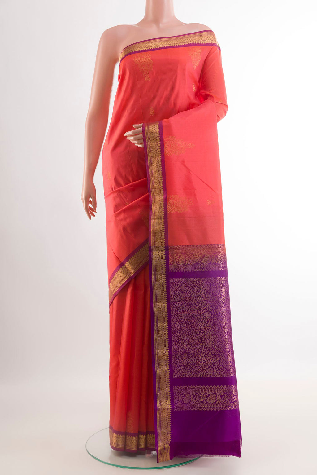Pink Kanjivaram Silk Saree with Zari Butta on the body and Zari Border.  displayed on a mannequin