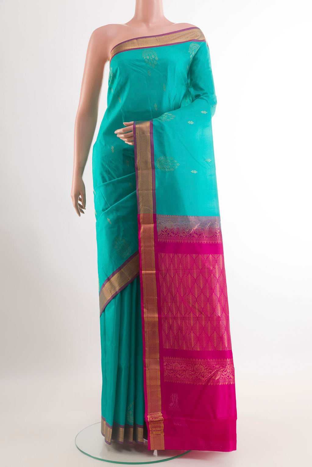 Blue Kanjivaram Silk Saree with Zari Butta on the body and Zari Border.  displayed on a mannequin