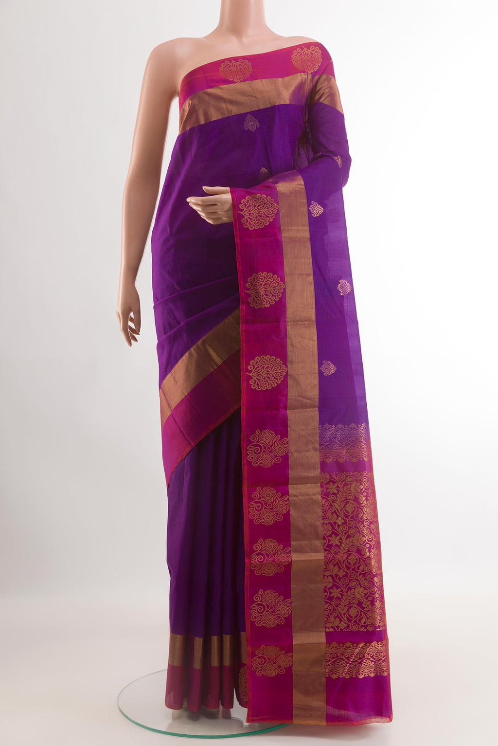 Purple Kanjivaram Silk Saree with Zari Butta on the body and Zari Border.  displayed on a mannequin