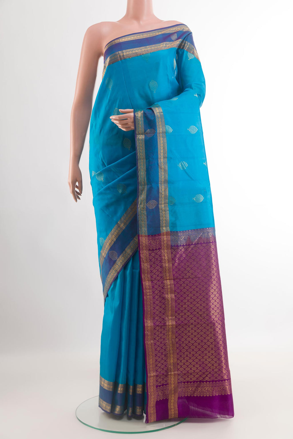 Blue Kanjivaram Silk Saree with Zari Butta on the body and Zari Border.  displayed on a mannequin