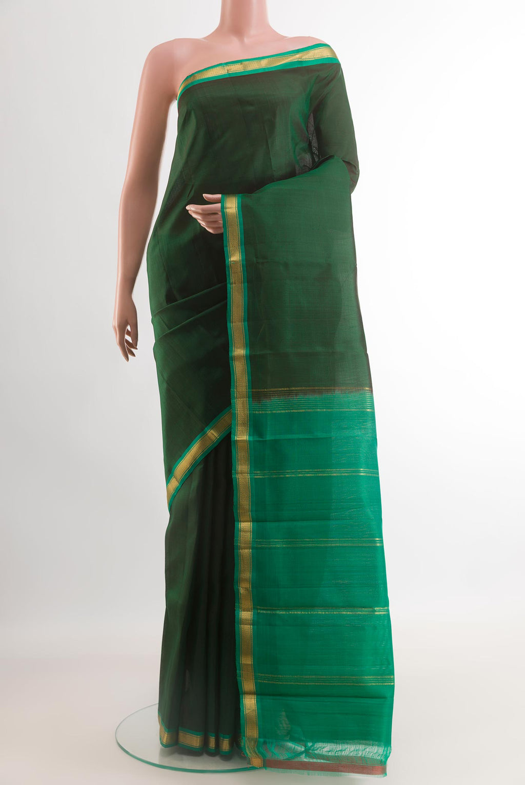 Bottle Green Kanchipuram Silk Saree with Plain Body and Zari Border.  displayed on a mannequin