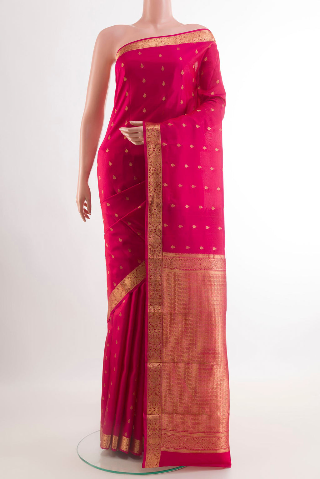 Pink Kanjivaram Silk Saree with Zari Butta on the body and Zari Border.  displayed on a mannequin