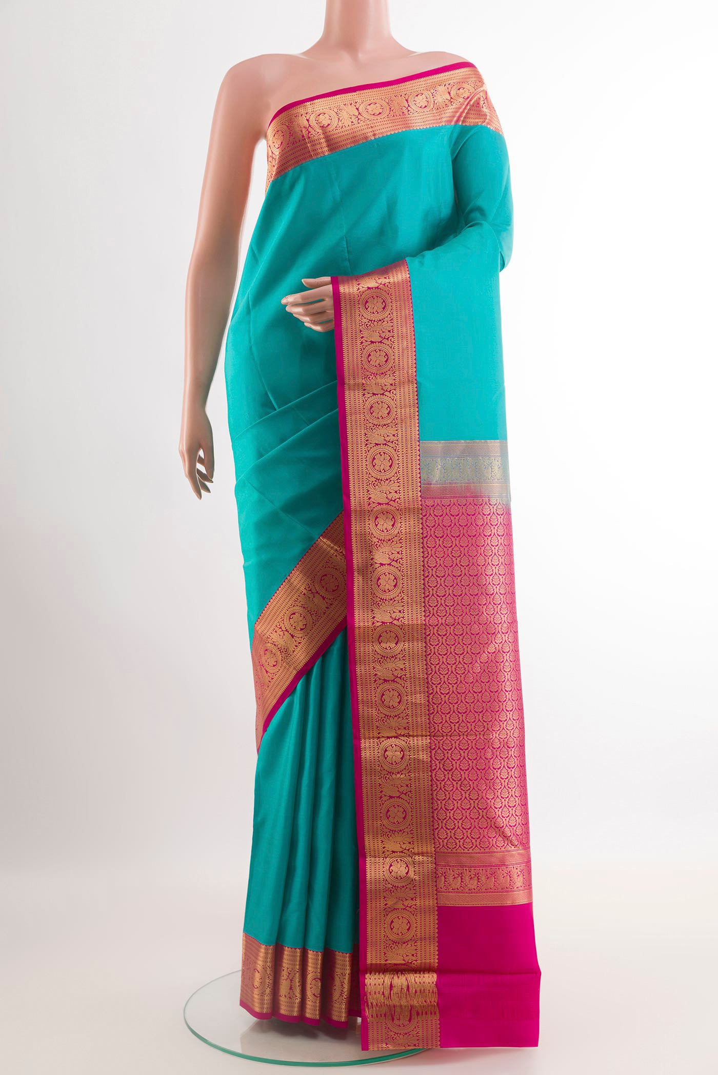 Blue Kanchipuram Silk Saree with Plain Body and Zari Border.  displayed on a mannequin