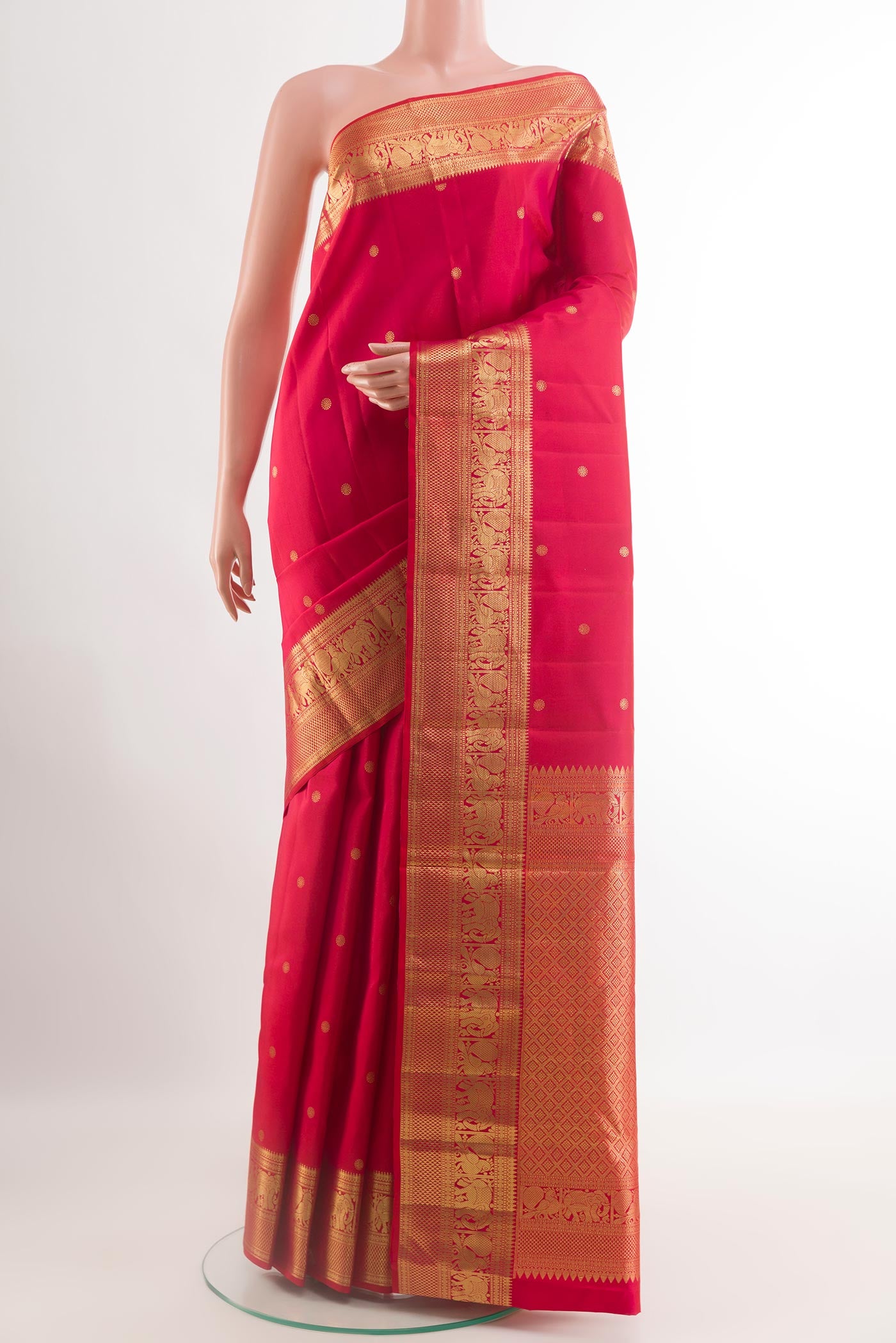 Red Kanchipuram Silk Saree with Zari Butta on the body and Zari Border.  displayed on a mannequin