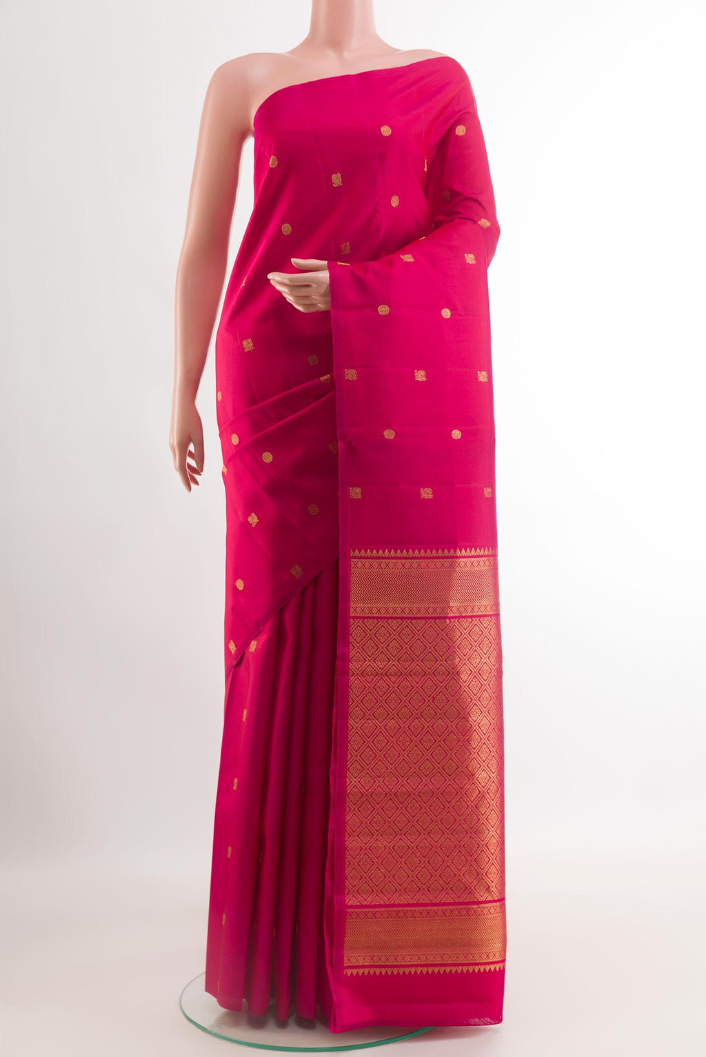 Pink Kanchipuram Silk Saree with Zari Butta on the body and Zari Border.  displayed on a mannequin