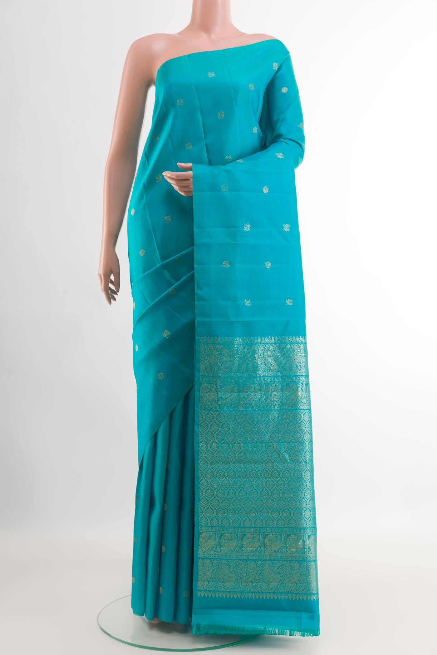 Blue Kanchipuram Silk Saree with Zari Butta on the body and Zari Border.  displayed on a mannequin