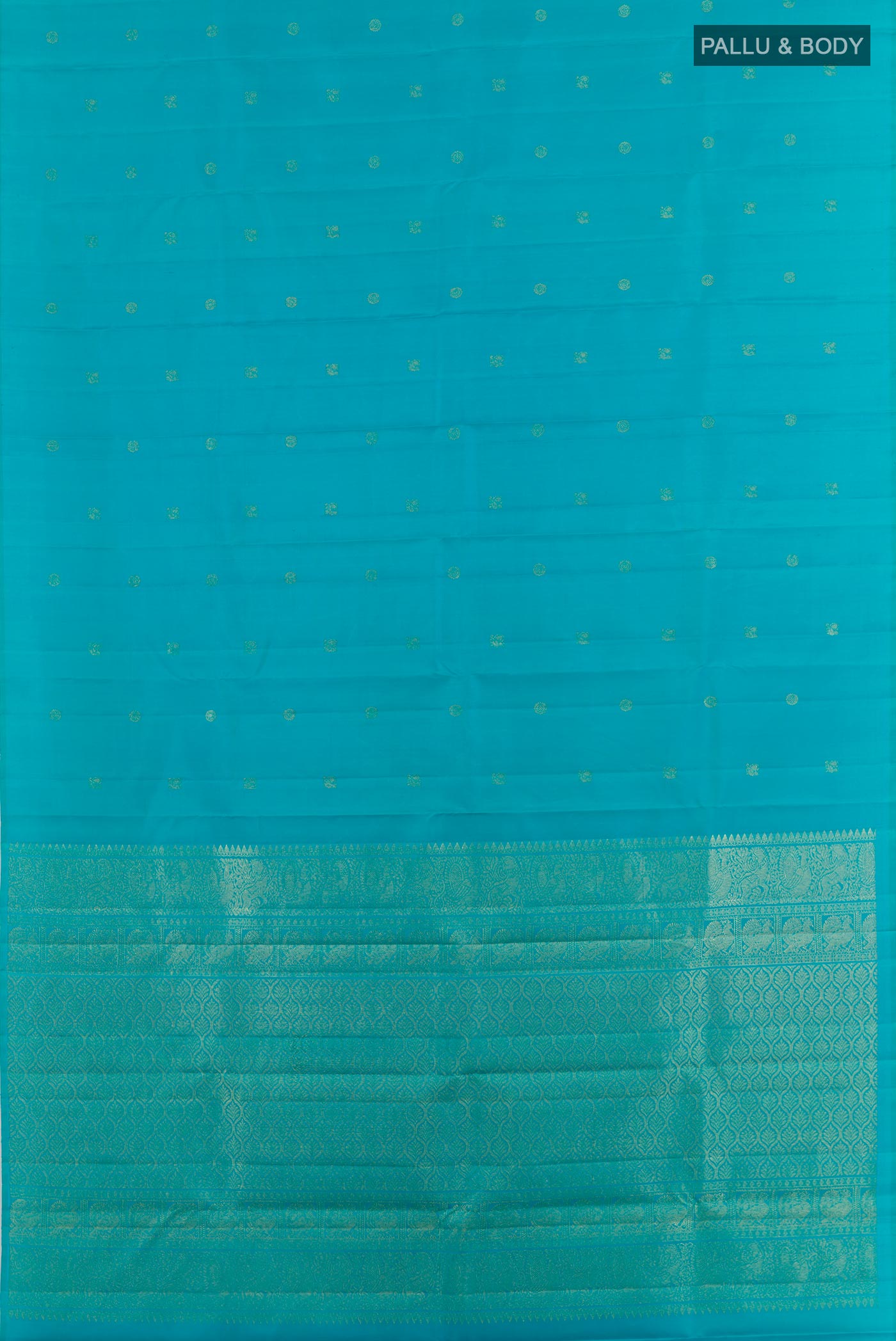Flat view of Blue Kanchipuram Silk Saree with Zari Butta on the body and Zari Border. 
