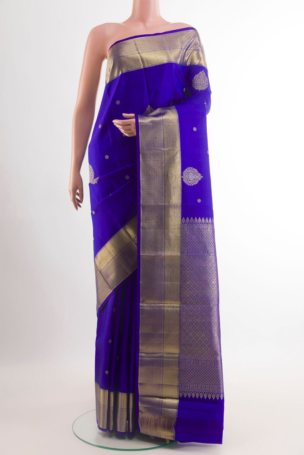 Blue Kanchipuram Silk Saree with Zari Butta on the body and Zari Border.  displayed on a mannequin