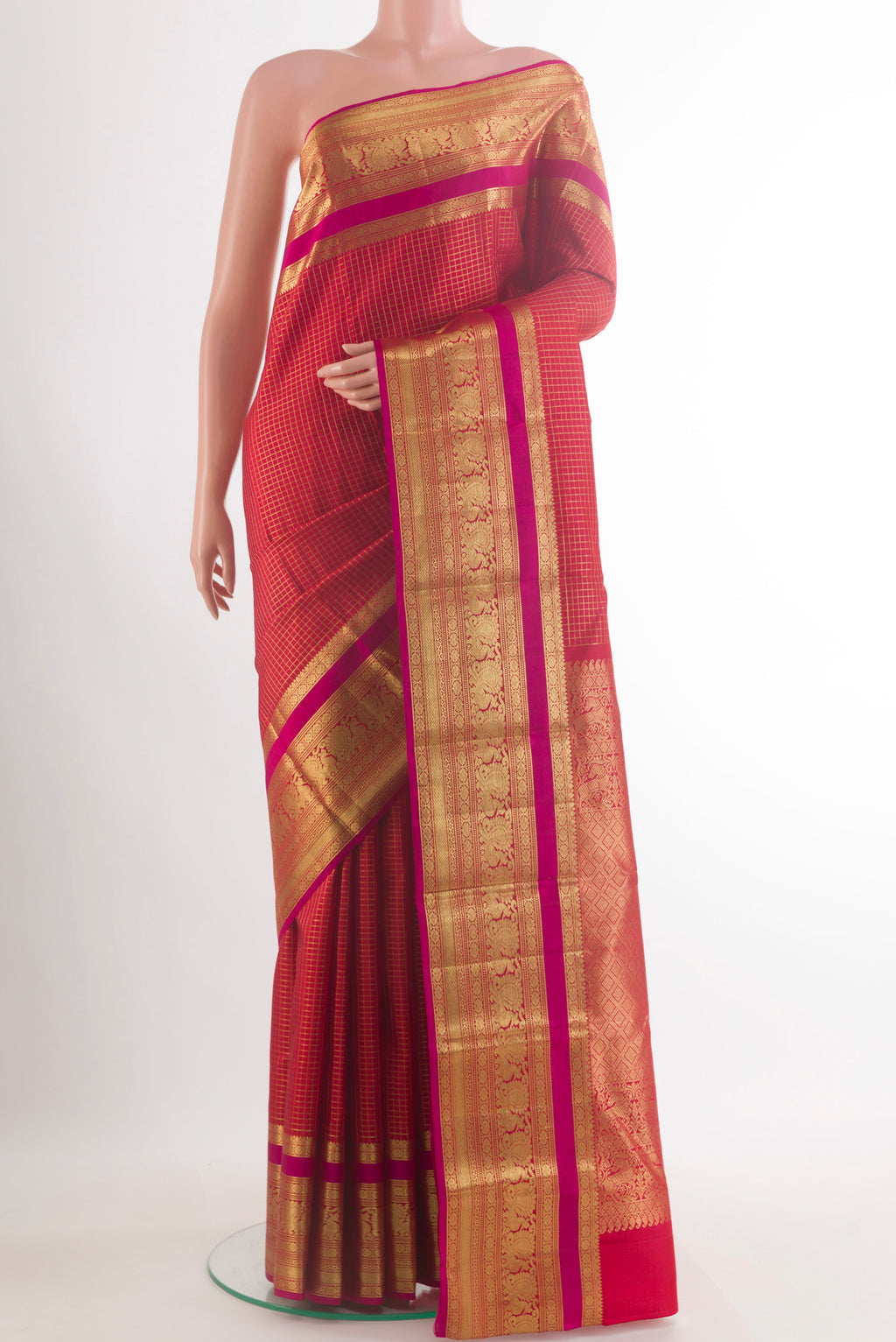 Pure Silk Red Kanjivaram Saree with Checked design on the body and Zari Border.  displayed on a mannequin