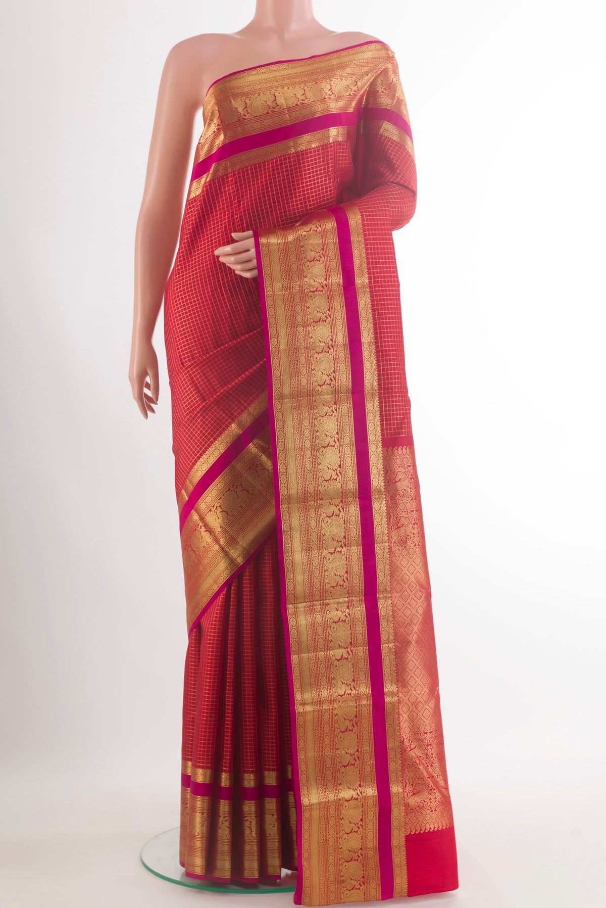Pure Silk Red Kanjivaram Saree with Checked design on the body and Zari Border.  displayed on a mannequin
