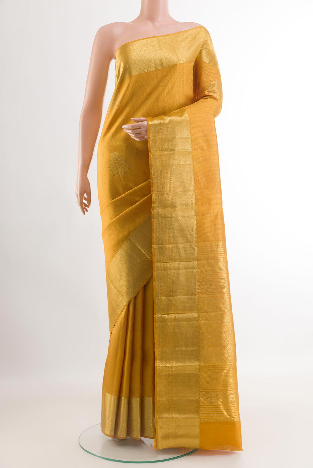 Yellow Kanjivaram Silk Saree with Zari Brocade on the body and Zari Border.  displayed on a mannequin
