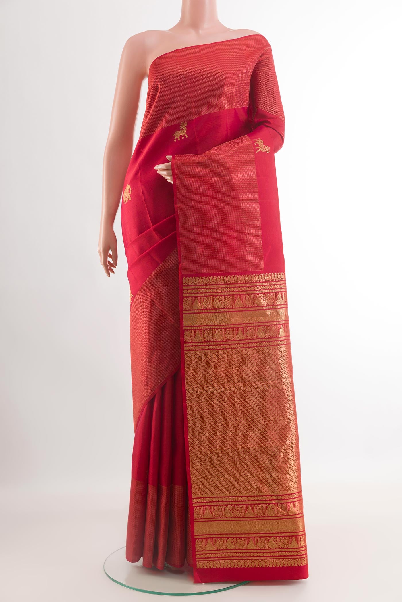 Red Kanjivaram Silk Saree with Zari Butta on the body and Zari Border.  displayed on a mannequin
