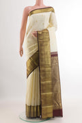 Off White Kanjivaram Silk Saree with Zari Butta on the body and Zari Border.  displayed on a mannequin