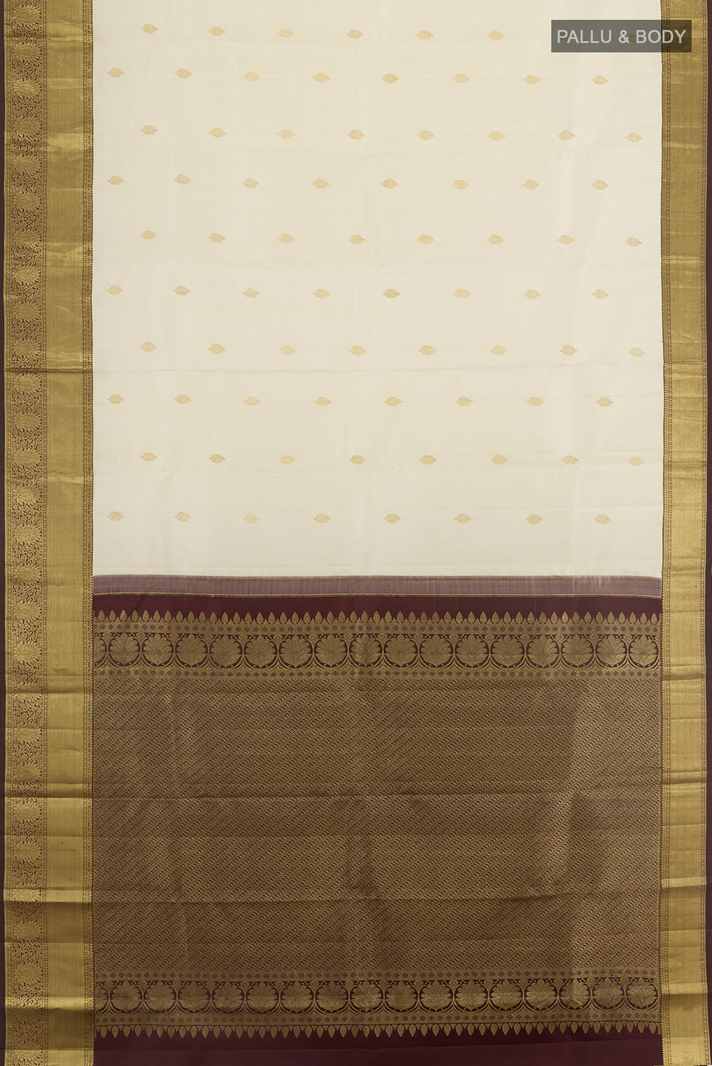Flat view of Off White Kanjivaram Silk Saree with Zari Butta on the body and Zari Border. 