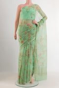 Green Mysore Chiffon Saree with Printed design on the body and Zari Border.  displayed on a mannequin