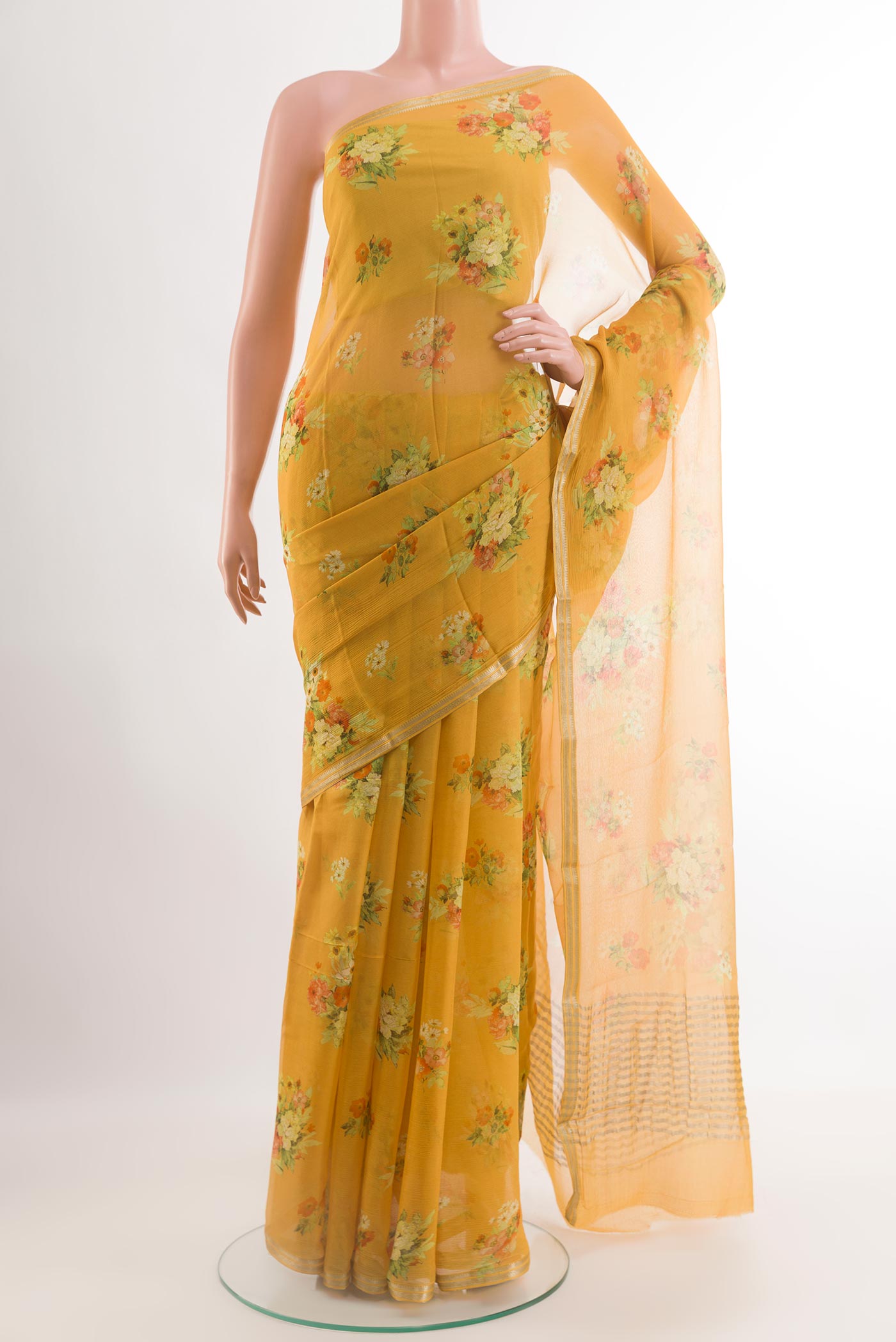 Yellow Chiffon Saree with Printed design on the body and Zari Border.  displayed on a mannequin