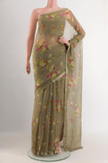 Olive Green Mysore Chiffon Saree with Printed design on the body and Zari Border.  displayed on a mannequin