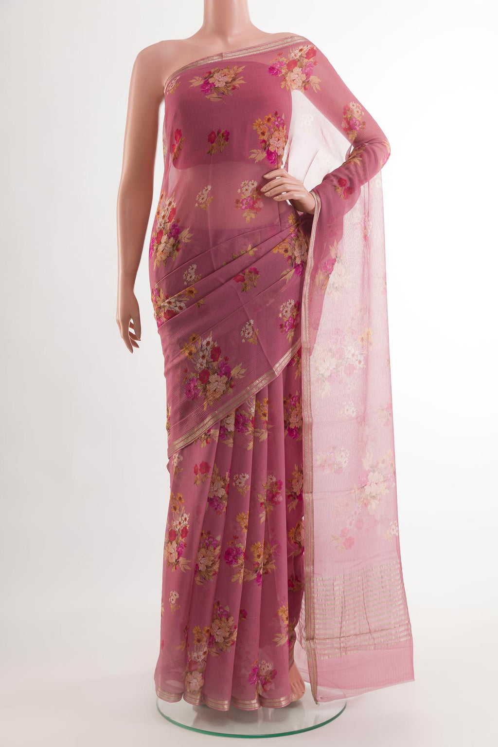 Pink Chiffon Saree with Printed design on the body and Plain Border.  displayed on a mannequin