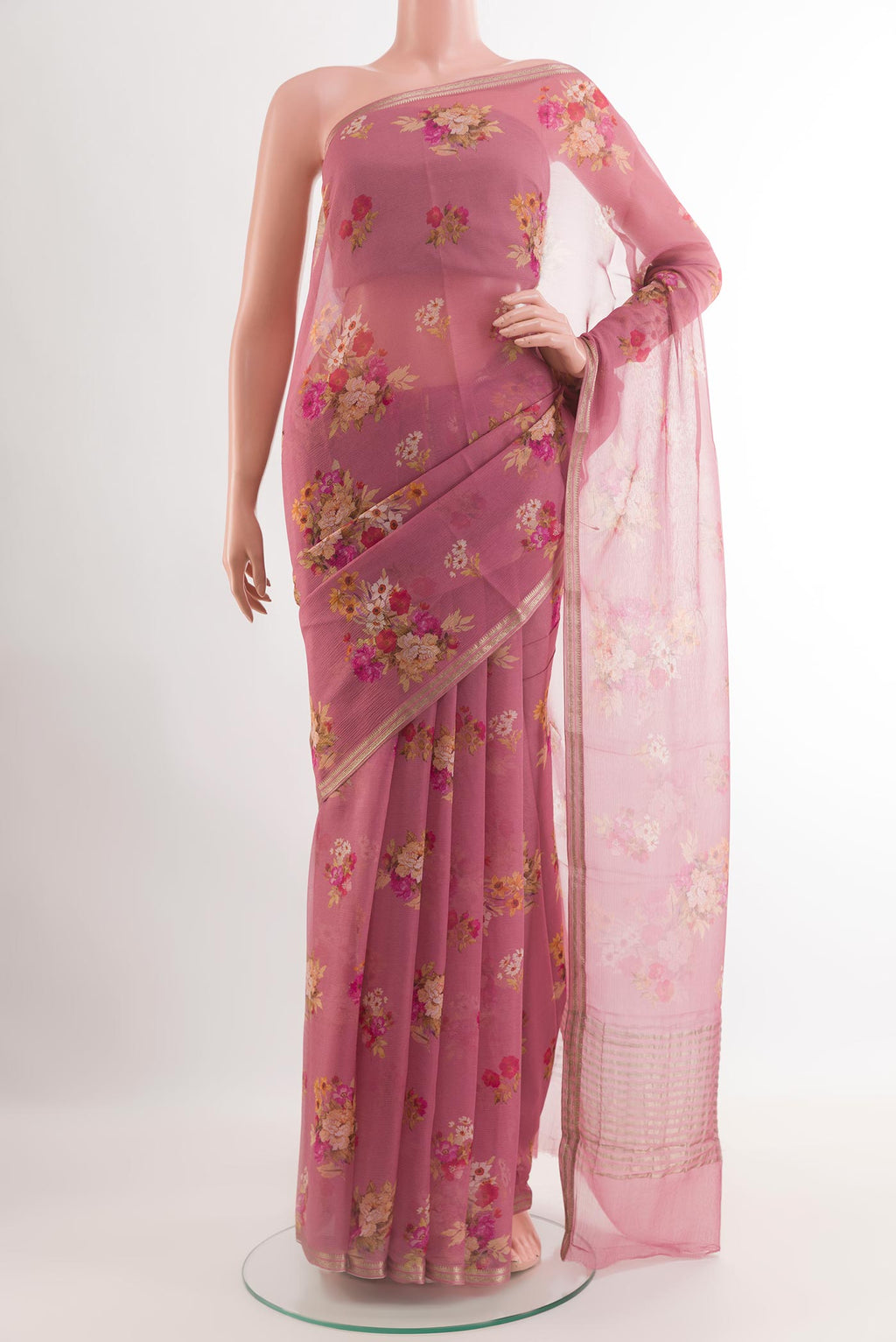 Pink Chiffon Saree with Stripes on the body and Zari Border.  displayed on a mannequin