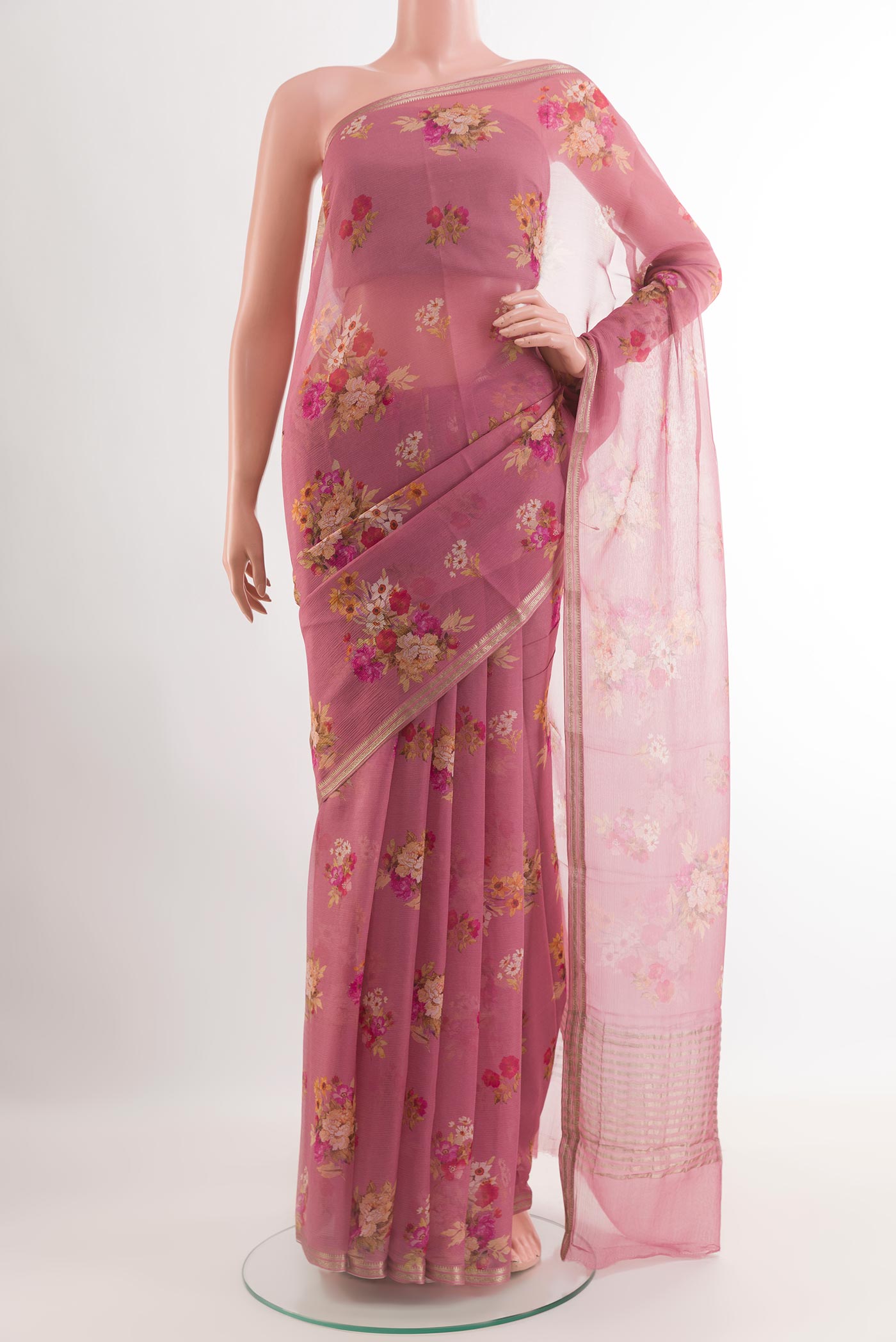 Pink Chiffon Saree with Stripes on the body and Zari Border.  displayed on a mannequin