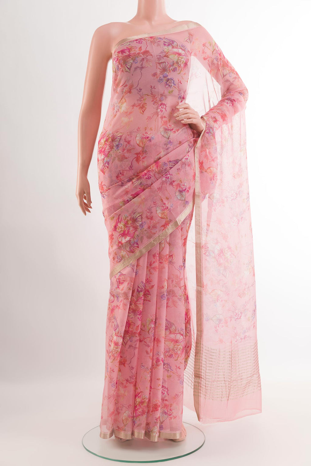 Pink Chiffon Saree with Printed design on the body and Zari Border.  displayed on a mannequin