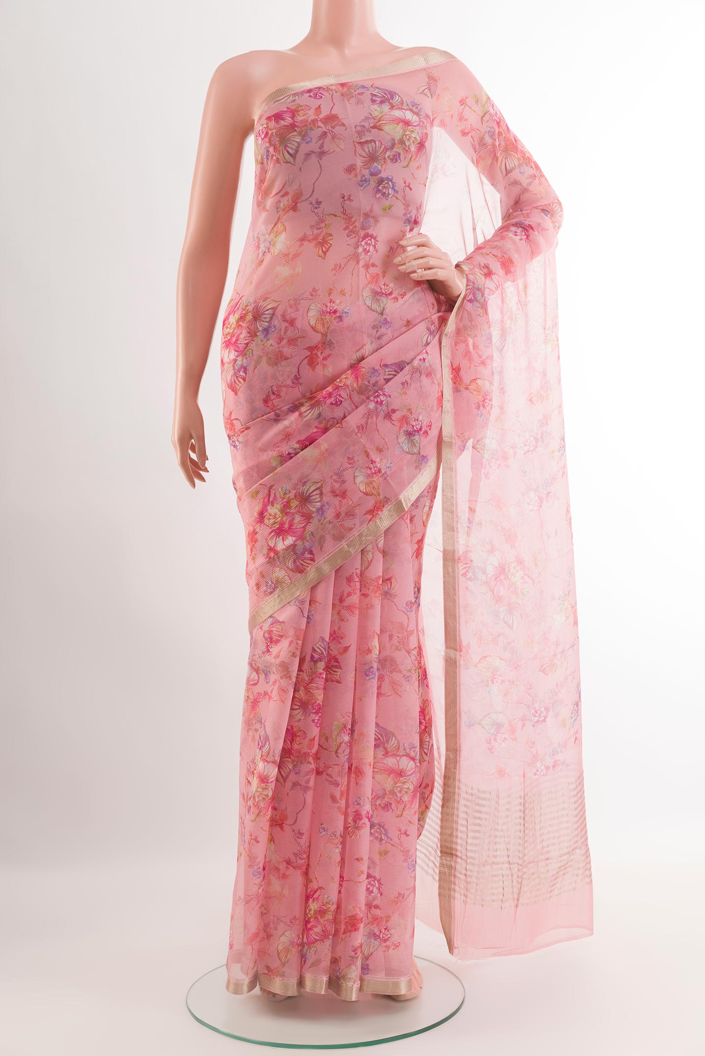 Pink Chiffon Saree with Printed design on the body and Zari Border.  displayed on a mannequin