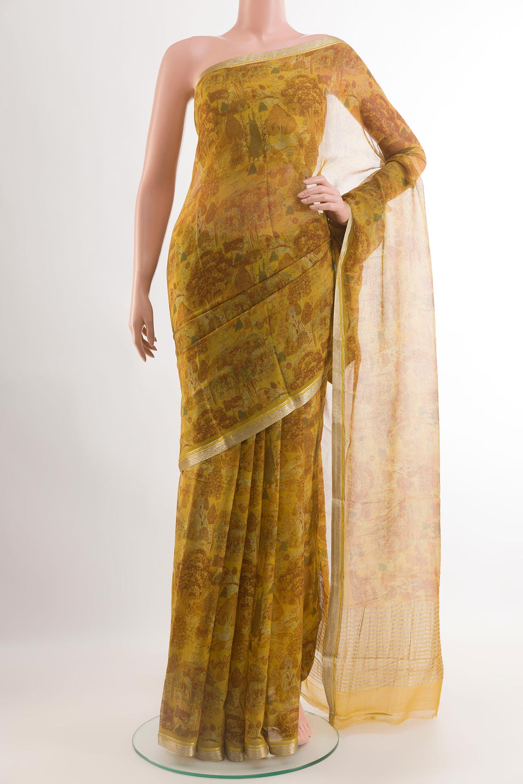 Yellow Chiffon Saree with Printed design on the body and Zari Border.  displayed on a mannequin