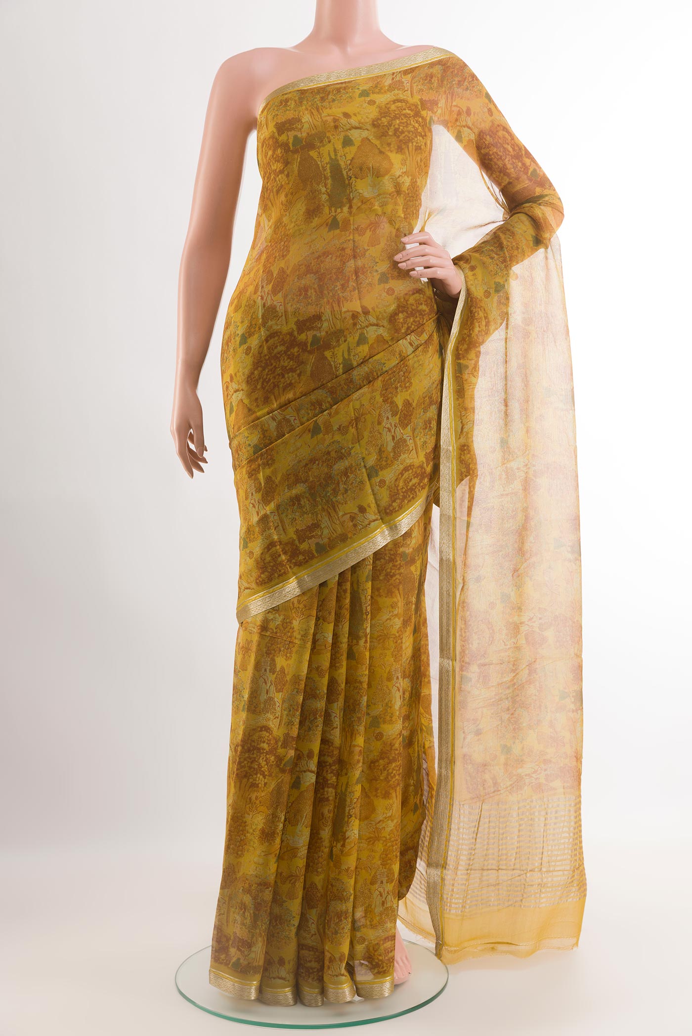 Yellow Chiffon Saree with Printed design on the body and Zari Border.  displayed on a mannequin