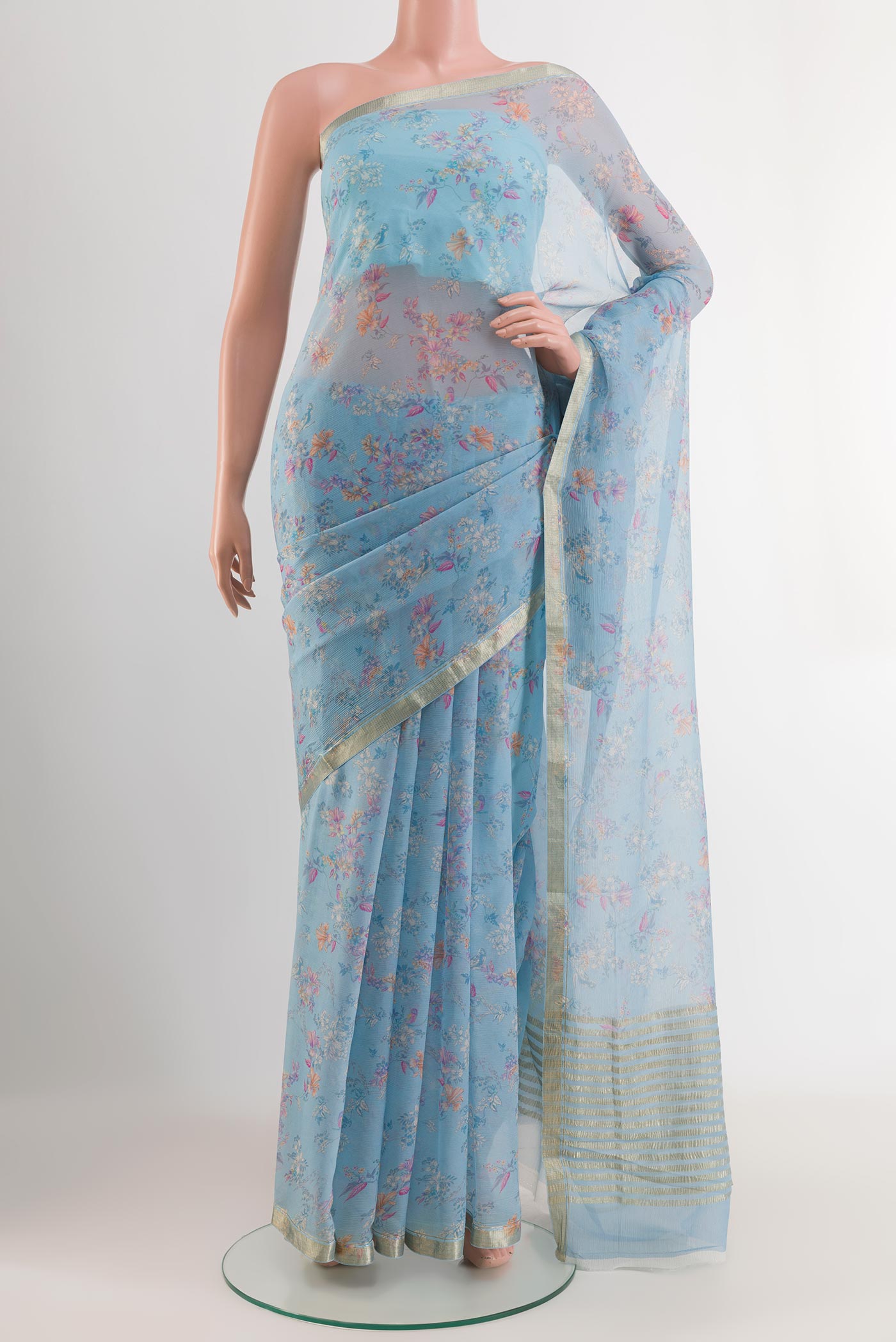 Blue Mysore Chiffon Saree with Stripes on the body and Zari Border.  displayed on a mannequin