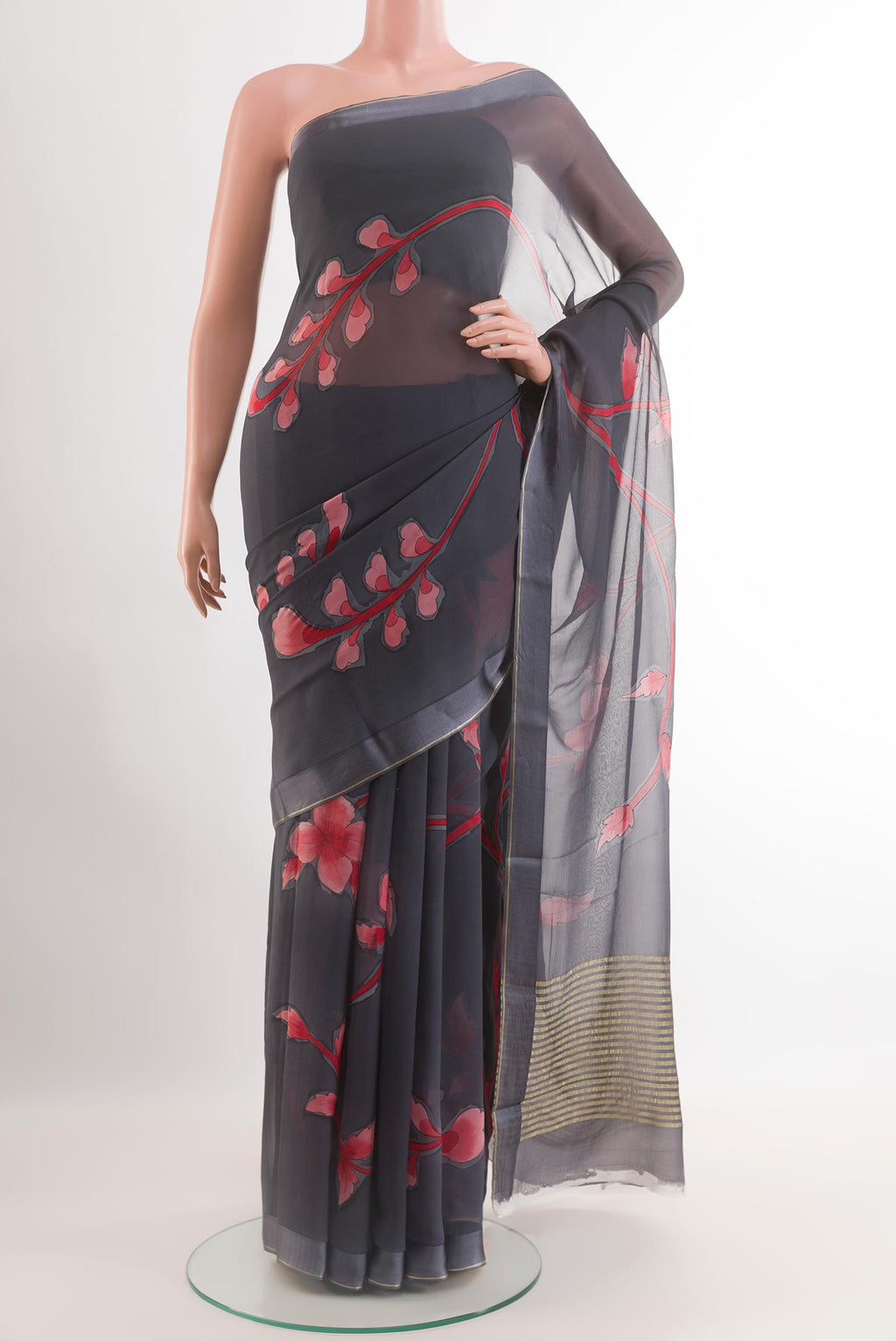 Grey Chiffon Saree with Printed design on the body and Zari Border.  displayed on a mannequin