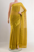 Yellow Mysore Chiffon Saree with Zari Butta on the body and Zari Border.  displayed on a mannequin
