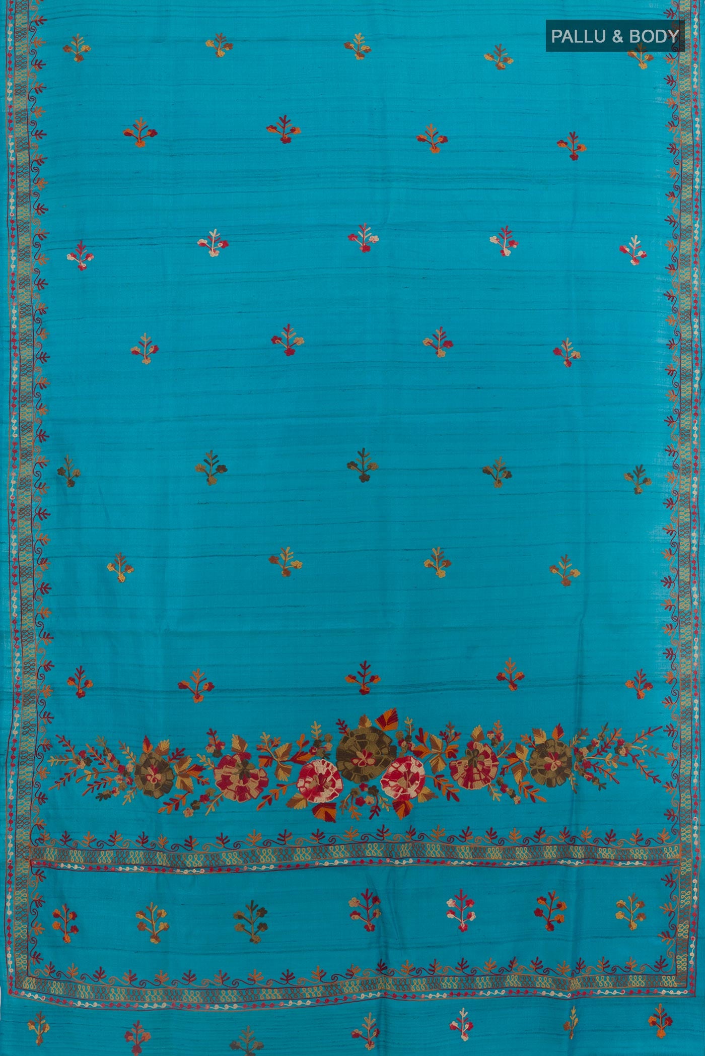 Flat view of Blue Tussar Saree with Embroidery on the body and Embroidery Border. 