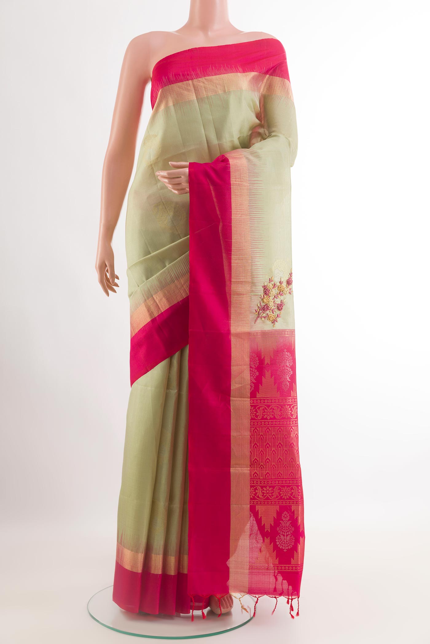Cream Soft Silk Saree with Zari Butta on the body and Zari Border.  displayed on a mannequin