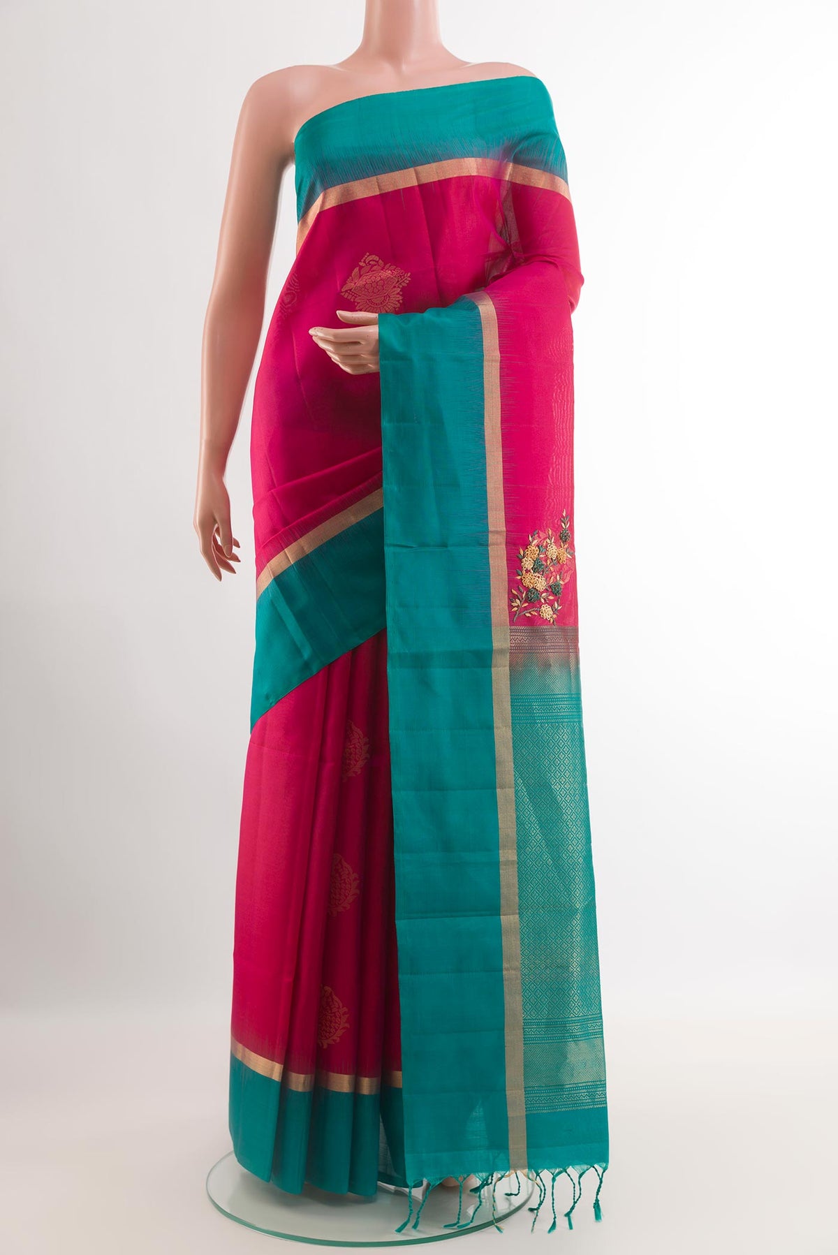 Pink Soft Silk Saree with Zari Butta on the body and Zari Border.  displayed on a mannequin