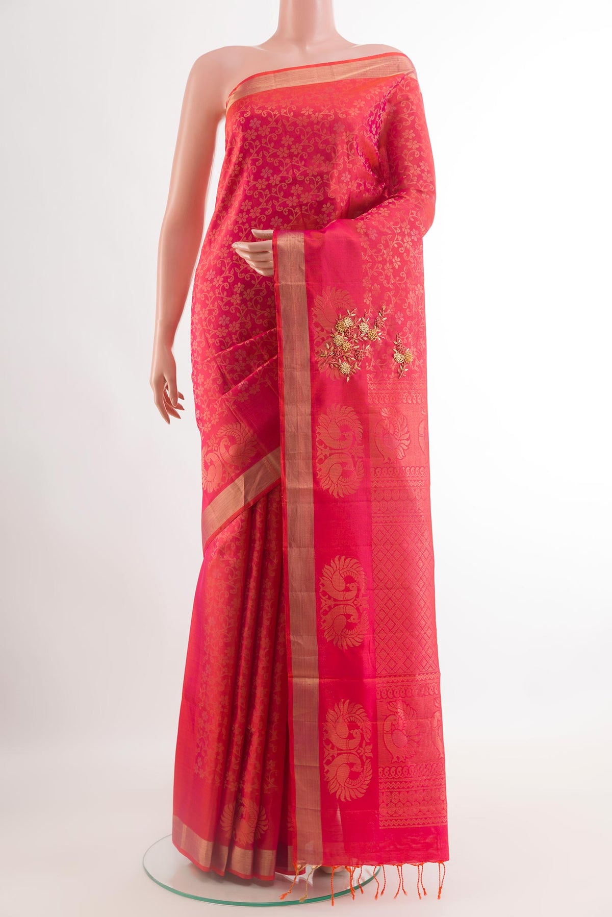 Pink Soft Silk Saree with Embroidery on the body and Zari Border.  displayed on a mannequin